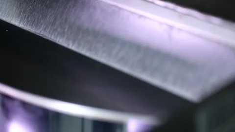 Close up shot of automatic rotating popcorn making machine with open lid mixing  Stock Footage 137541568