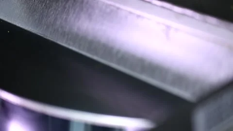 Close up shot of automatic rotating popcorn making machine with open lid mixing  Stock Footage 137541581