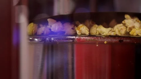 Close up shot of automatic stainless steel dry cheese caramel salt sweet flavor  Stock Footage 138773885
