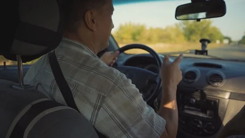 Close up shot back funny couple in car woman in passenger seat dance sings man Stock Footage 116997485