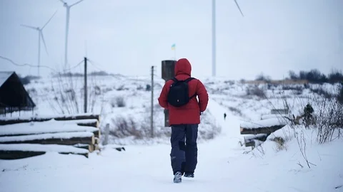 Close up shot back man run along in winter mountains snow lifestyle equipment Stock Footage 105204672