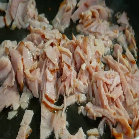 A close up shot of a bacon cooking. Stock Footage 69487536