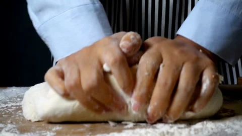Close up shot of bakery worker knead flour bread Baker making dough with na.. Stock Footage 272470464