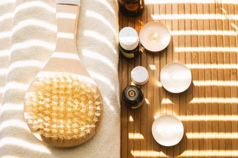 Close-up shot of bathing brush with essential oils and candles. SPA concept. 写真素材