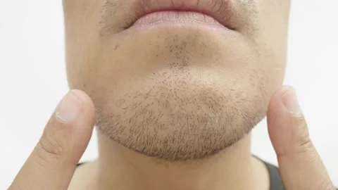 Close-up shot of a bearded Asian's face. Video stock 237698035