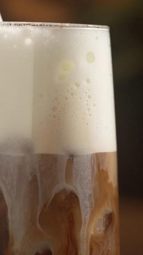 Close up shot of a beautiful, smooth visual swirl as milk blends into the d.. Stock Footage 335516588