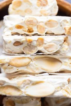 A close-up shot beautifully captures a stack of traditional Spanish hard turr Stock Photos
