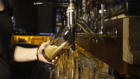 Close up shot of a beer mug being filled with beer. Slow Motion. High quali.. Stock Footage 265768879