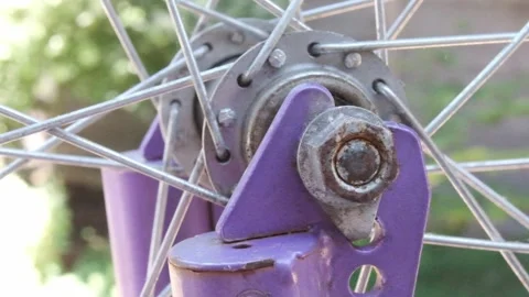 Close up shot of a bicycle fork and spokes and components 스톡 동영상 313089154