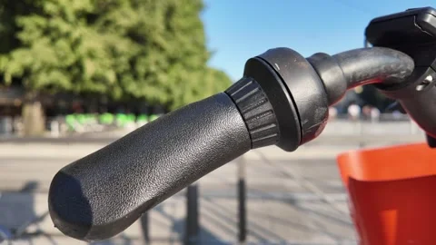 Close-up shot of bicycle handlebars with grips and controls Stock Footage 314719787