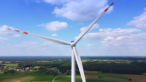 Close up shot of big windmill on the blue sky Video stock 143354336