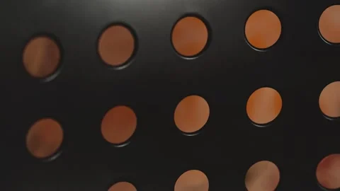 A close-up shot of a black and orange polka dot pattern, ideal for use in d.. Stock Footage 332225037