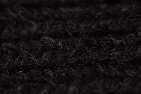 A close-up shot of a black carpet, capturing its intricate texture and stru.. Stock Photos