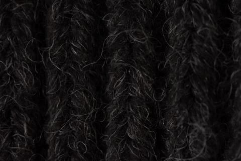 A close-up shot of a black carpet, capturing its intricate texture and stru.. Stock Photos