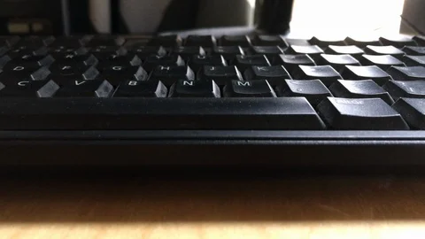 Close up shot of black computer keyboard on office desk in the morning Stock Footage 107603156