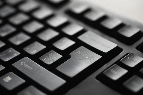 Close-up Shot of Black Computer Keyboard with Focus on Enter Key 스톡 사진