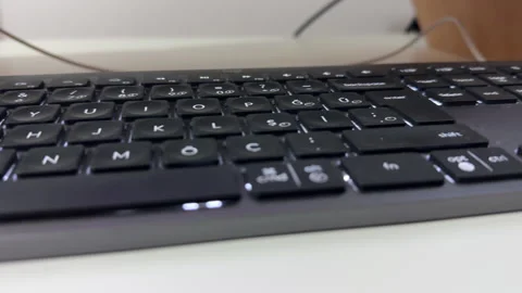Close up shot of black keyboard and computer inside office Stock Footage 314364282