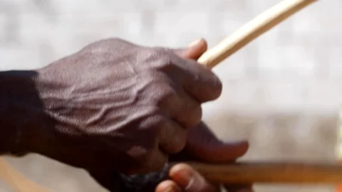 Close shot of black man hand playing drums with wooden stick Video stock 113167858