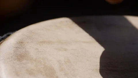Close shot of black man playing djembe with plaster on finger Stock Footage 113120278