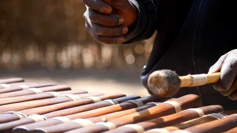 Close shot of black man playing Balafon instrument Stock Footage 113165838