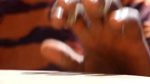 Close shot of black man playing djembe with plaster on finger Stock-Footage 113168333