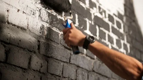 Close Up Shot of Black Paint being applied on a wall. Room Renovations at Home Video stock 195532968