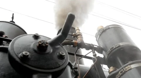 Close up shot of black steam engine locomotive. smoke smoking Video stock 43548448
