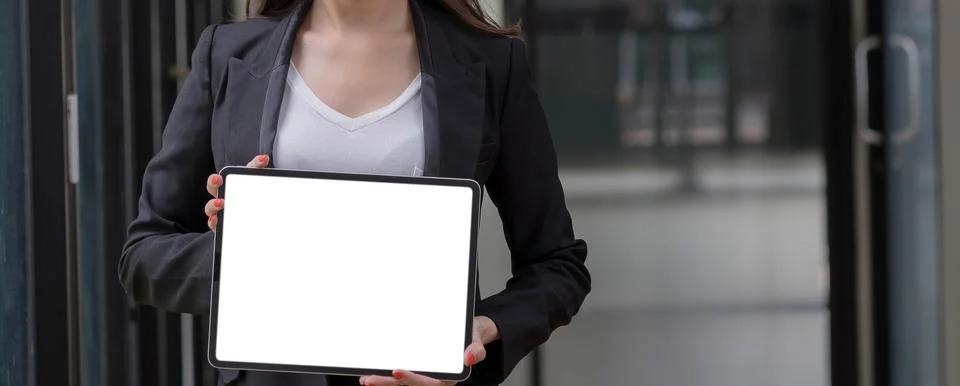 Close-up shot on blank tablet computer showing businesswoman with two hands.. Foto stock