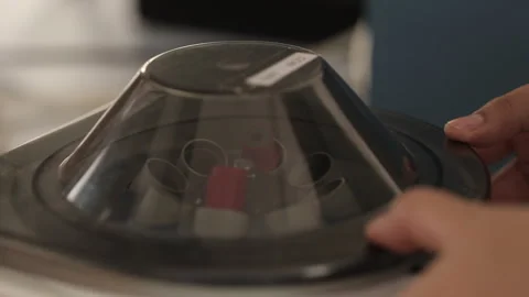 Close-up shot of blood samples spinning in centrifuge during Stock Footage 263091476