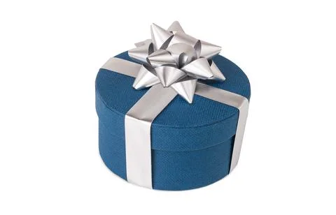 A close up shot of a blue round gift box covered with a silver bow isolated o Fotos de archivo