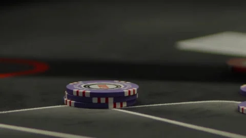 A close-up shot of blurry fingers placing yellow poker chips Stock Footage 336237796