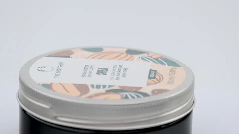 Close up shot of Body Shop multi-purpose cosmetic set, face,body and hair Stock Footage 259829777
