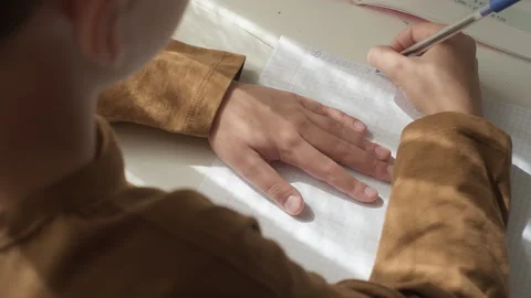 Close-up shot of boy solving math problem. Concentrated kid school boy studying Stock Footage 252215575