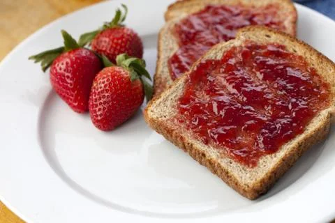 Close up shot of bread and jam in plate Stock Photos