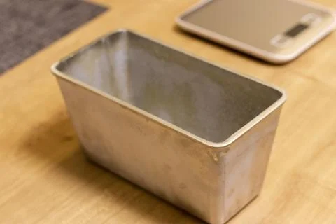 Close up shot of the bread loaf pan on the kitchen counter top. Baking Stock Photos