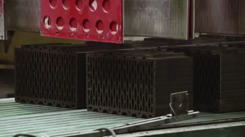 Close up shot of bricks moving on a conveyor Stock Footage 58264913