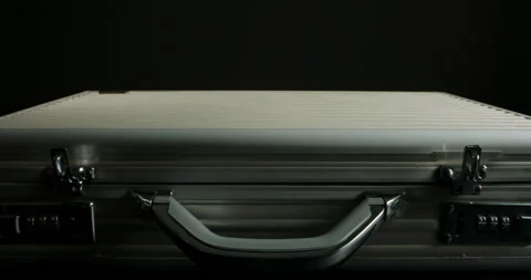 Close up shot of briefcase full of 100 US dollars packs getting opened. A Stock-Footage 149844210