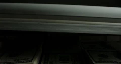Close up shot of briefcase full of 100 US dollars packs getting closed. A Stock-Footage 162256184