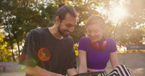 Close-up shot of a brunette guy in a gray T-shirt and a girl with a short Video stock 250240307