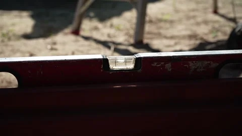Close up shot of Bubble Level Tool. Leveling tool on construction site Stock Footage 258645597