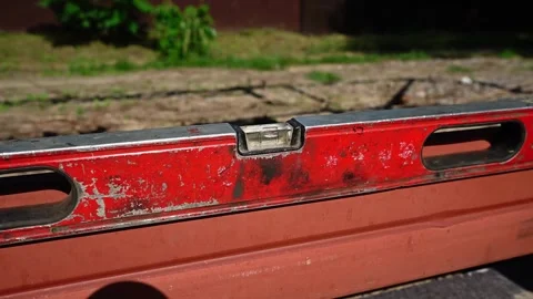 Close up shot of Bubble Level Tool. Leveling tool on construction site Stock Footage 258645599