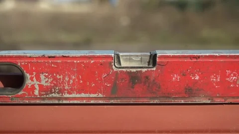 Close up shot of Bubble Level Tool. Leveling tool on construction site Video stock 261283760