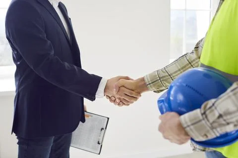 Close Up Shot Of Builder And Developer Shaking Hands 写真素材