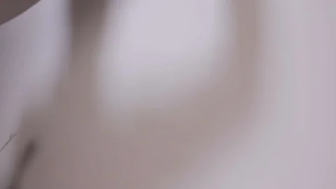 A Close Shot At The Builder Hands, Who Level The Wall With A Long Spatula Stock Footage 101382986