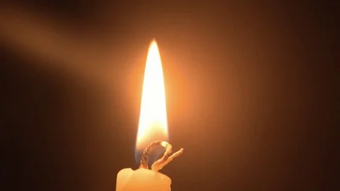Close up shot to burning candle yellow light Stock Footage 80399934