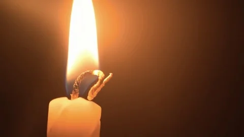 Close up shot to burning candle yellow light Stock Footage 80399991