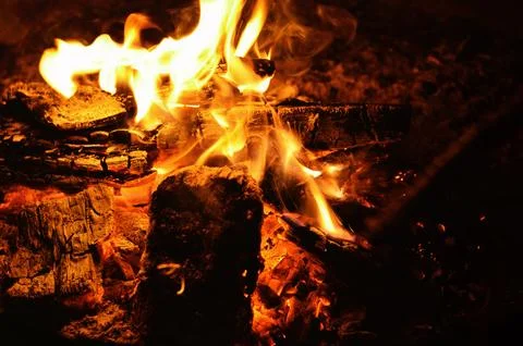 A close-up shot of a burning log in a campfire Stock Photos