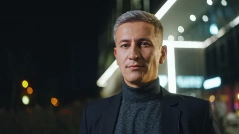 Close up shot of business man outside at night. Male in official suit standing Stock Footage 303669728