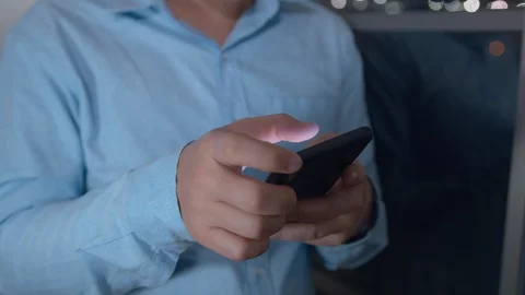 Close up shot of Businessman Using Smartphone browsing internet, checking email Video stock 128237697