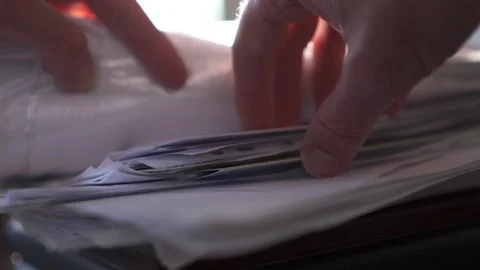 Close-up shot of a businessman working with documents in an office Stock Footage 309402571